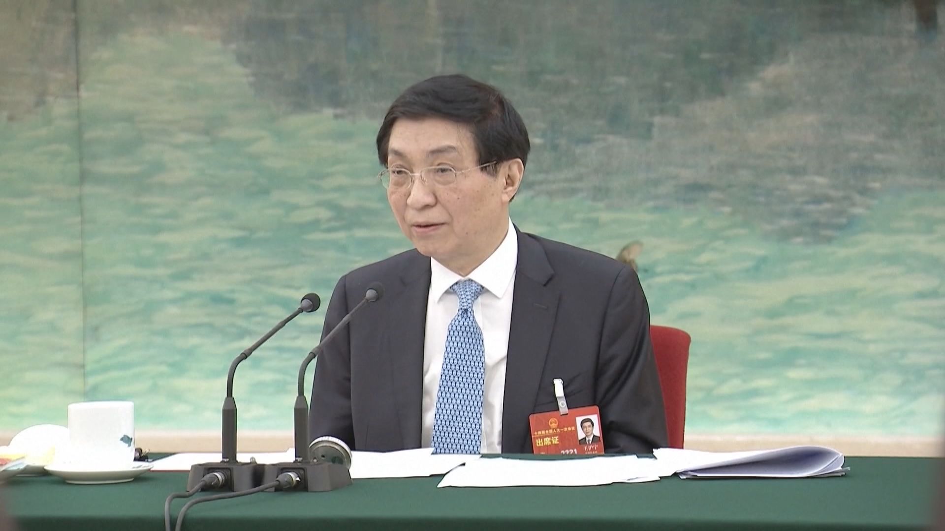 王滬寧：堅定不移爭取和平統一前景