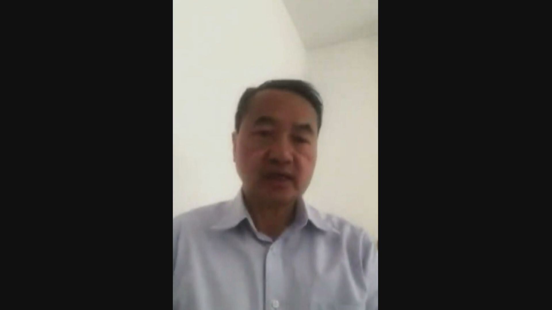 李永達指身處英國不能親身參與黨務因此退出民主黨