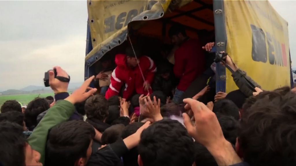 默克爾籲從根本解決難民問題